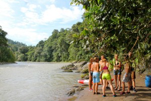 People standing next to the river Pacuare
