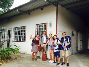 Family of five in front of a Hostel