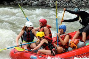 Rafters in red raft with guide
