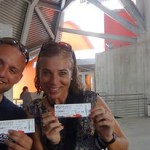 Two people holding entrance tickets in front of biomuseum