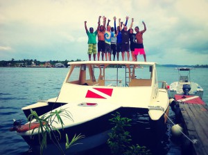 group atop catamaran in caribbean landscape