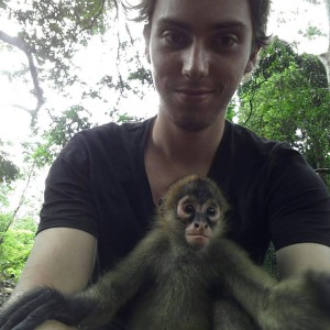 Volunteer holding baby monkey