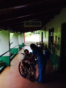Older woman in a wheelchair with staff