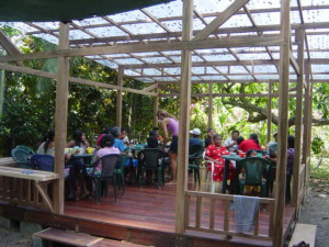 Rancho with tables, chairs and people.