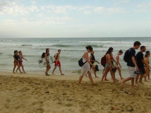 Group walking down beach