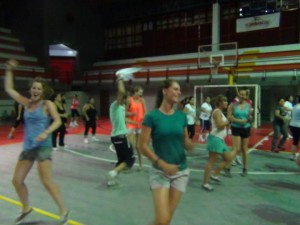 Happy group of students working out with zumba