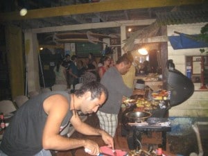 Two persons doing barbecue in party