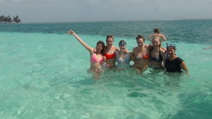 Girls swimming in crystal clear caribbean sea