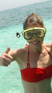 Smiling girl in snorkel gear