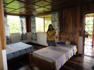Girl posing in room with 3 beds in Turrialba - Costa Rica