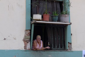 woman in window smiling at the camera