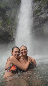 Girls in front of cascading waterfall