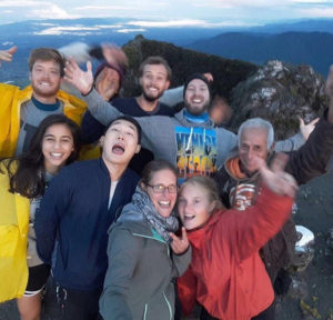 Happy students on top of a volcano